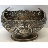Hallmarked silver bowl with embossed and pierced decoration. G J DF London 1906 approx 256gms. 17cms