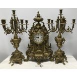 A late 20thC reproduction decorative brass garniture clock/candelabra set, Italian made, clock 60cms