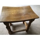 A Robert Thompson Mouseman oak stool, 15 inches h x 16 inches w x 11 inches d.