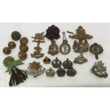 Box of various regimental badges, buttons and crowns. J.R. Gaunt, Irish. 24 pieces.