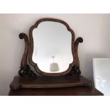 A 19th century mahogany toilet mirror. 89cmsw x 28cms d x 82cms h.