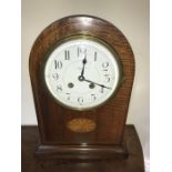 Mahogany cased mantle clock with shell inlay to case.