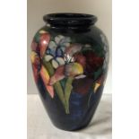 An orchid pattern Moorcroft vase 33cms h. Condition ReportSome damage and repair.