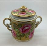 A 19thC Derby lidded Stevenson and Hancock jar decorated in gilt and pink roses, 10cms h, good