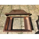 A copper fire hood with copper fire surround opening. 51 x 45cms, base of hood 102cms.