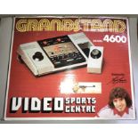 Grandstand video sports centre, model 4600, boxed, with guns etc,
