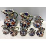 Eight 19thC Masons Ironstone jugs with lizard handles, largest 25cms h.Condition ReportFour a/f,