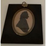 A 19thC silhouette of Rev. Joseph Gilbert. 1770-1852. 13 x 11cms.