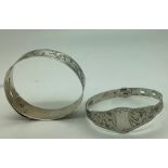 Two Chester hallmarked silver bangles, 1921/1927, one by Charles Horner. 34.7gms.