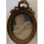 A framed watercolour portrait of a baby in a gilded wood frame. 7.5 x 5cms. Condition ReportChip