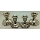 Two pairs of silver candlesticks, tallest 6.5cms h.