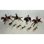 Vintage cast metal models of Huntsmen women, fox and hounds with a DInky wheelbarrow and Indians