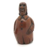 A late 18th/early 19thC coquilla nut novelty snuff box in the form of a gentleman with long buttoned