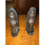 A pair of Art Deco style cast metal and black marble figural bookends bearing the signature Lorenzl.