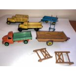 A collection of Dinky playworn toys to include Halesowen Farm Trailer, Dodge Tipper Truck, Tipper
