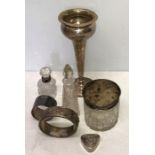 Silver vase (weighted base) bangle, napkin ring, pillbox marked 925, silver topped glass bottle &