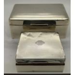Two silver cased cigarette boxes, Chester 1940 and Birmingham 1929. Some dents.