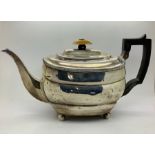 A silver teapot with ebony handle and ivory knop, London 1811, possibly Thomas Hayter, 590gms