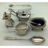 Silver to include a 3 piece cruet with blue glass and spoons, a glass lined shell shaped container