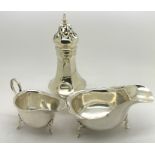 A silver sugar Birmingham 1927 caster together with two silver jugs. 288.2gms.Condition ReportOne