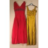 Two 1950's evening dresses, one silk Chiffon with embroidery detail the other Demi Dress in Satin.