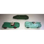 Three playworn Dinky toys to include MG, Jaguar Type D 238 and Aston Martin.