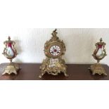 French clock garniture clock and two vases.
