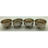 Four silver salts, reeded with ball feet, Birmingham 1875. 88.2gms.