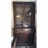 A 19thC mahogany secretaire bookcase secretaire drawer over 2 cupboards, 2 glazed doors to top.