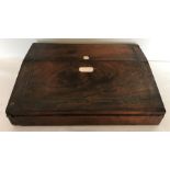 A 19thC rosewood lap desk, mother of pearl inlay opening to reveal velvet covered writing slope,