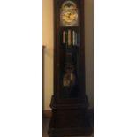 A good quality brass faced long cased clock with rolling moon and 3 train movement with