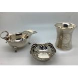 Silver to include sauce boat Birmingham 1938, a christening mug Birmingham 1911 with inscription,