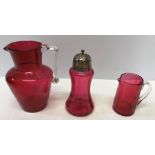 Three pieces of 19thC cranberry glass including a silver topped sugar shaker, Birmingham 1905 and