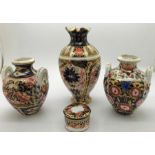 A pair of vases, 8cms h together with a Royal Crown Derby vase, 12cms h and a Royal Crown Derby