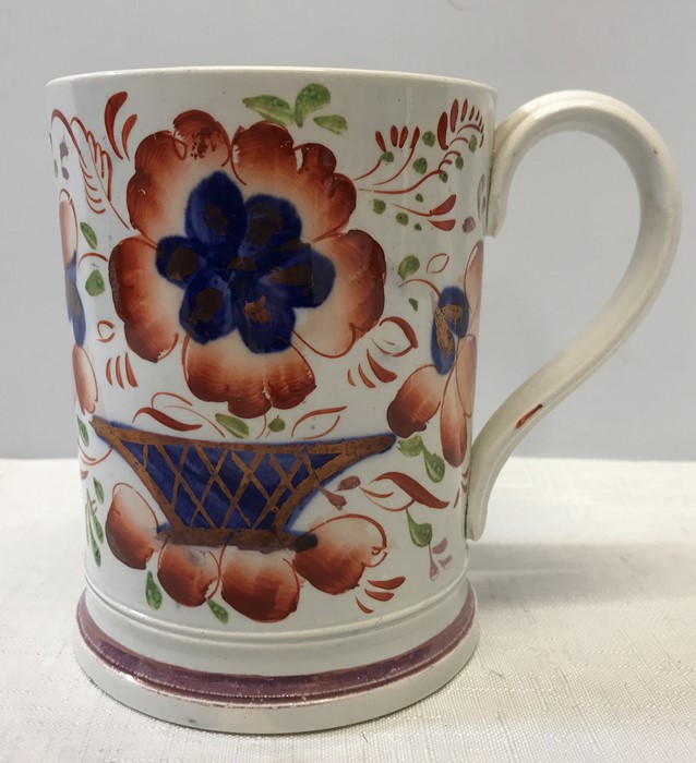 A late 19thC lustre mug in good condition with surprise frog to interior. 12cms h.