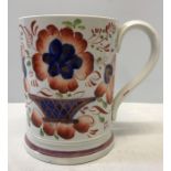 A late 19thC lustre mug in good condition with surprise frog to interior. 12cms h.