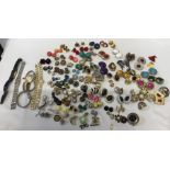 A large quantity of vintage clip on earrings, brooches, ladies wristwatches including one marked