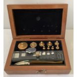 A vintage laboratory analytic weights set in a mahogany box. 8 x 13 x 3.5 cms. (metric)