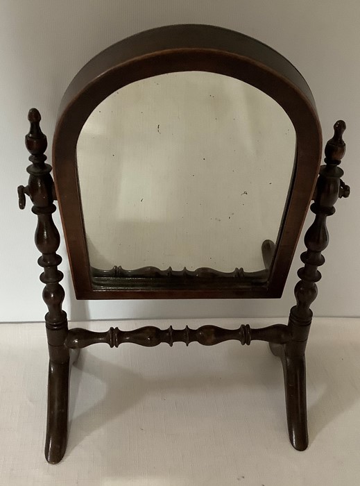 A 19thC miniature mahogany cheval mirror. 30cms h 20cms w. Condition ReportFew spots to glass