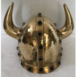 An unusual good quality vintage hand hammered brass Viking helmet with cabochon set stones. 22cms h.