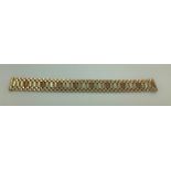 A 9 carat 3 colour gold link bracelet. 26.3gms, 19cms l.