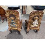 A pair of early 20thC Tibetan ceremonial chairs with gilt decoration to top.