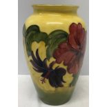 A Moorcroft Hibiscus pattern vase, 21cms h, impressed marks, green signature and paper label to