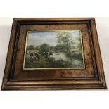 A framed oil on board, signed L.R G Williams. Cows By A River. 12 x17cms.