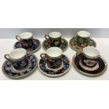 Six Wedgwood coffee cans and saucers with different patterns on each. All good condition.