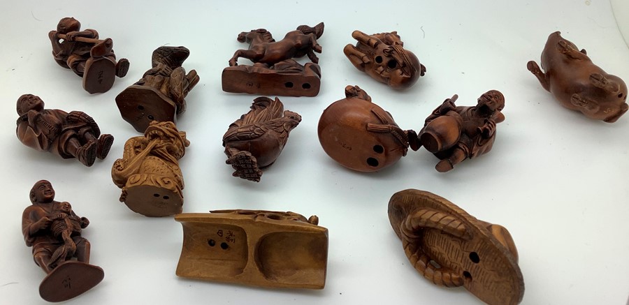 Twenty eight various modern Chinese wood and tagua nut and resin netsukes. Condition ReportTwo - Image 4 of 6