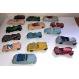 A large collection of playworn Dinky convertible cars to include Jaguar, Armstrong Siddelet, Sunbeam