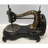 Jones and Co cast iron hand wind sewing machine.