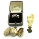 An ivory hand seal, a 19thC double opening locket, unmarked inscribed 1872 and a 19thC ring set with