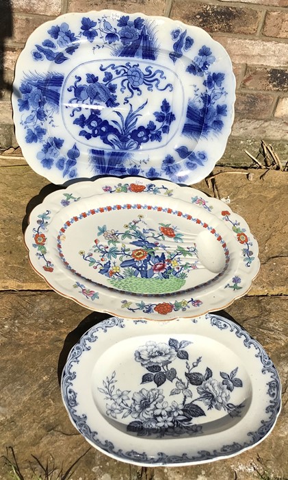 Three large meat platters,the blue and white having slight crack. Largest 43 x 53cms.